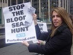 Flipper holds up sign to attract attention.